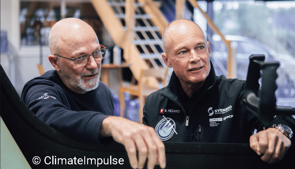 Raphael Dinelli and Bertrand Piccard Examining Climate Impulse Aircraft Cockpit Controls